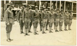 A Group of Soldiers Lined Up in Two Rows Standing at Attention